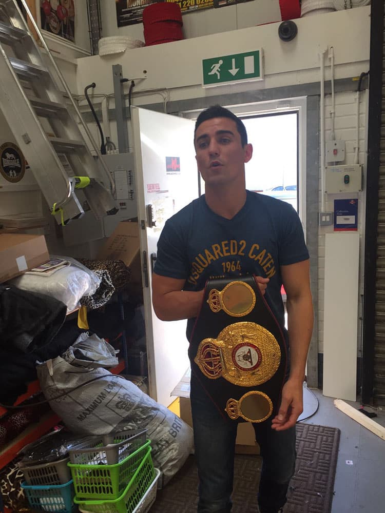 crolla with world title belt