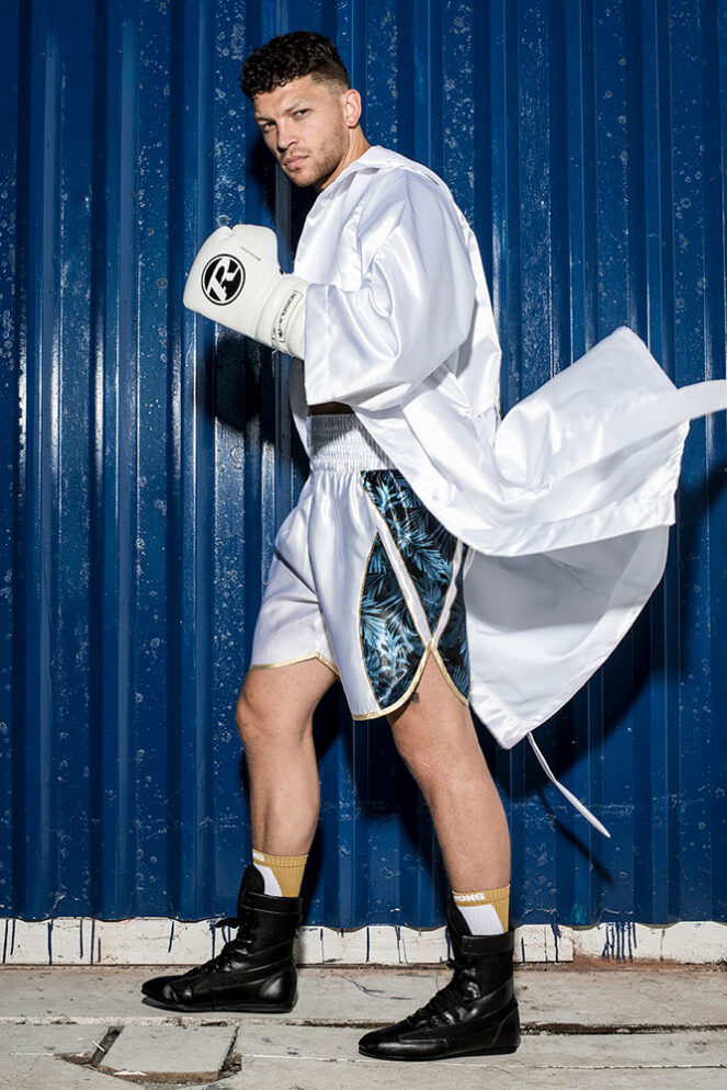 White customisable boxing ring robe on boxer entering the ring