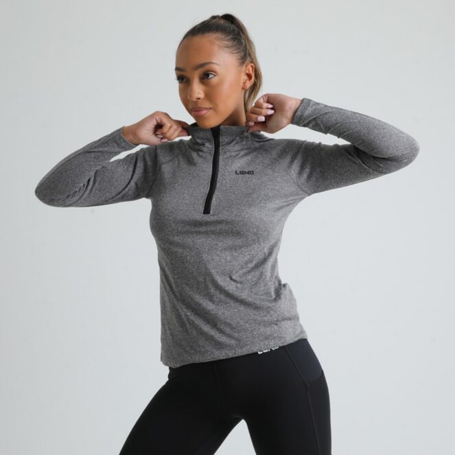 LGND Women's Performance Zip Training Top on Female Model