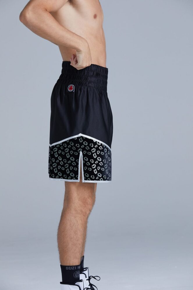 Side detail of a Boxer in the Crusade Black & Silver Boxing Shorts