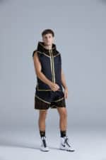 Boxer in the Crusade Black & Gold Boxing Ring Jacket and Shorts