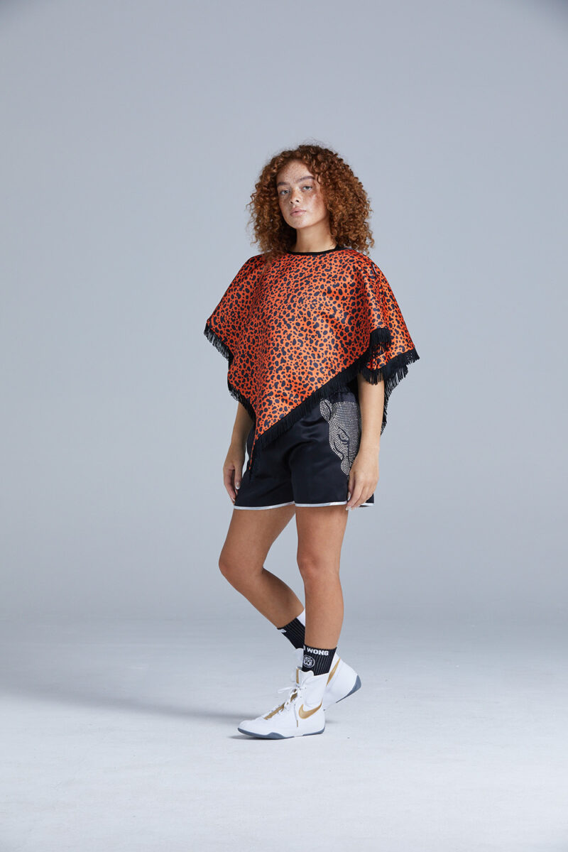 Black and Orange Cheetah Print Poncho on Female Boxer