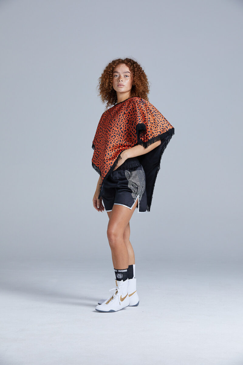 Black and Orange Cheetah Print Poncho on Female Boxer