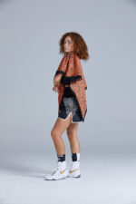 Black and Orange Cheetah Print Poncho on Female Boxer